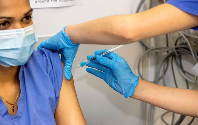 December 29, 2020: Nithya Rajendran receiving the Pfizer / BioNTech vaccine at St. James’s Hospital in Dublin 8.