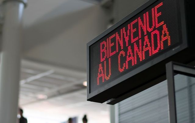 A welcome sign at the Canadian border of Montréal–Pierre Elliott Trudeau International Airport.