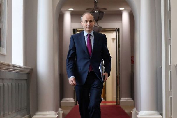 January 12, 2021: Taoiseach Micheal Martin with a copy of the Final Mother and Baby Home Report on his way to a live video link with survivors and stakeholders.