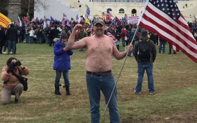 Chris Kelly was photographed shirtless outside the Capitol Building on January 6. 