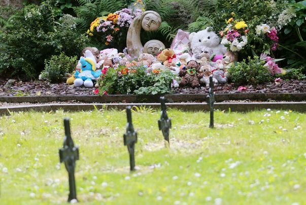 Children\'s teddy\'s and toys along with flowers sit at the \'Little Angels\' memorial plot in the grounds of Bessborough House in Blackrock, Cork