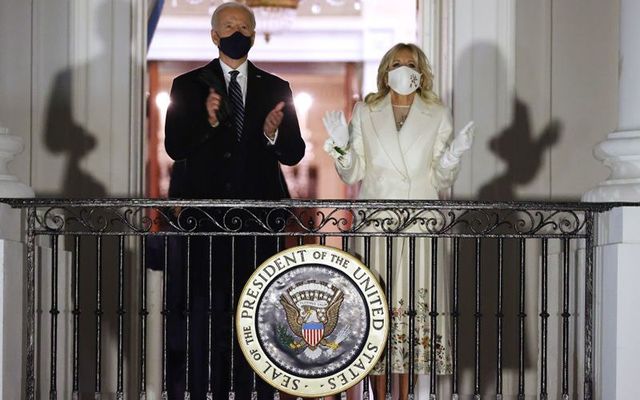 U.S. President Joe Biden and First Lady Jill Biden watch a fireworks show on the National Mall from the Truman Balcony at the White House following the inauguration ceremony at the U.S. Capitol on January 20, 2021 in Washington, DC. 