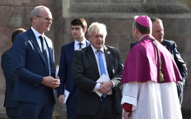 Irish Minister for Foreign Affairs Simon Coveney and British Prime Minister Boris Johnson talk to Roman Catholic Primate of Ireland Eamon Martin at the \"Service of Reflection and Hope\" in Armagh on Thursday. 