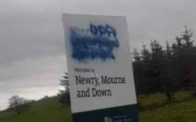Vandals scrawled \"UDA\" over an Irish language sign in South Armagh. 