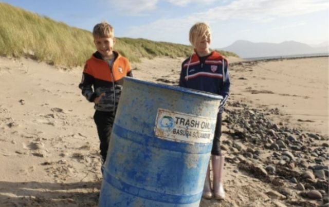 n! Two children on Mulranny Beach, County Mayo beach photographed with the South Carolina Beach trash can.