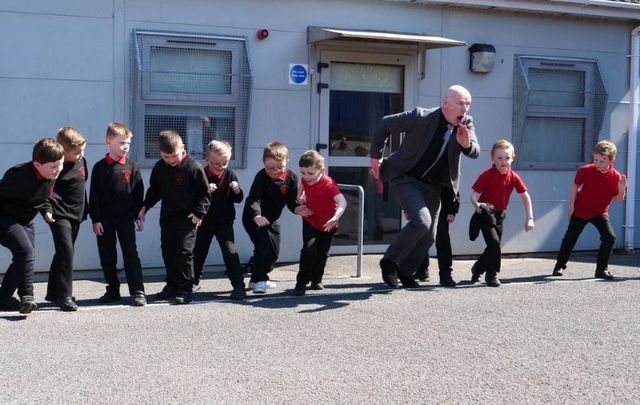 Headmaster Kevin McArevey with students in Belfast.