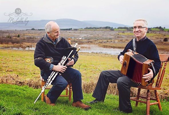 Oliver O\'Connell playing alongside piper Mickey Dunne. 