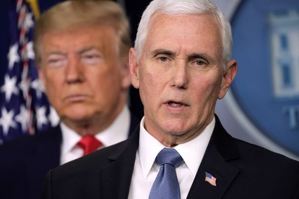 Former vice president Mike Pence, with former president Trump standing to his rear.