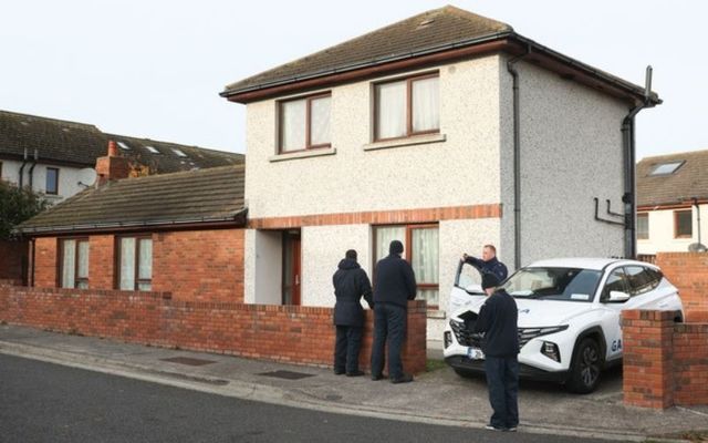 Gardai gather outside the home of Christopher Hall on Thursday. 