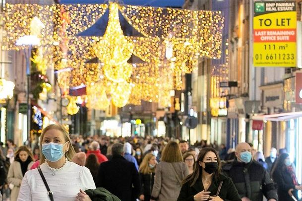 December 18, 2020: People wear face masks as Christmas shoppers do their shopping and enjoy the atmosphere of Dublin City Center.