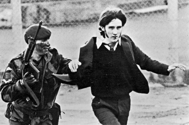 January 30, 1972: A British paratrooper takes a captured youth from the crowd on Bloody Sunday, when British paratroopers opened fire on a civil rights march, killing 14 civilians in Derry, Northern Ireland.