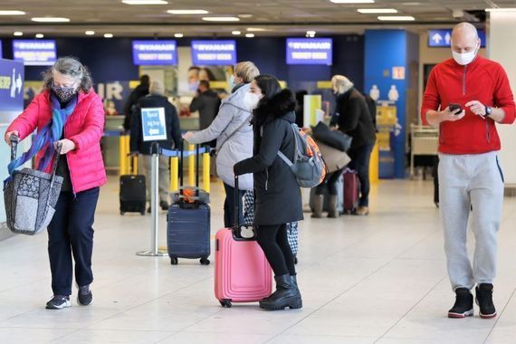 Travelers arrive in Dublin Airport on December 4, 2021. 