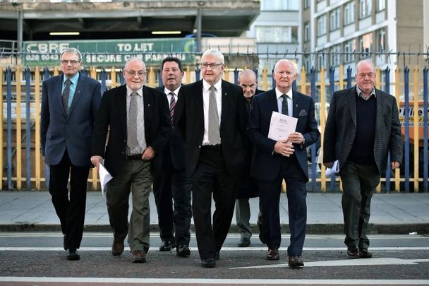 March 20, 2018: Jim Auld, Patrick McNally, Liam Shannon, Francis McGuigan, Davy Rodgers, Brian Turley and Joe Clarke, known as the \'Hooded Men,\' make their way from a press conference after giving their reaction to the European Court of Human Rights\' decision in their case in Belfast, Northern Ireland. The ECHR rejected a request by the Irish government to find that the men who were detained during internment in 1971 were tortured by the British army. The 14 men allege they were forced to listen to constant loud music, deprived of sleep, food, and water, and forced to stand in a stress position and beaten if they fell.