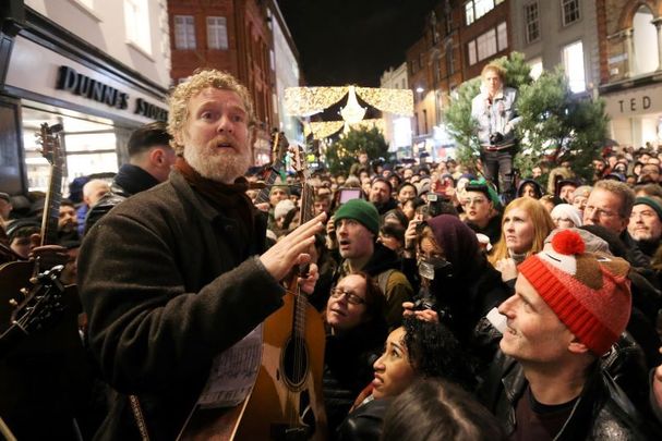 December 24, 2016: Irish singer-songwriter Glen Hansard leads musicians busking on Grafton Street in Dublin for the traditional Christmas Eve event to raise money for the homeless charities. 