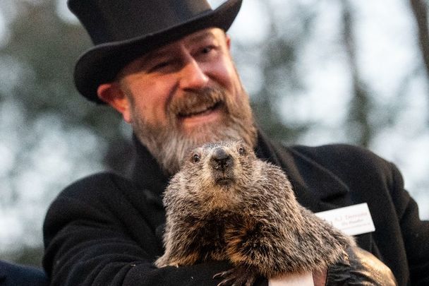 February 2, 2023: Groundhog handler AJ Dereume and Punxsutawney Phil, who saw his shadow, predicting a late spring during the 137th annual Groundhog Day festivities in Punxsutawney, Pennsylvania.