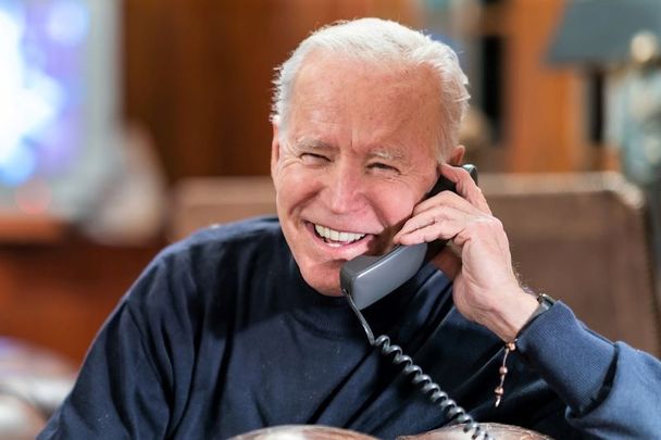 February 7, 2021: President Joe Biden talks on the phone with service members attending Super Bowl LV watch parties in Kabul and aboard the USS Nimitz at the Lake House in Wilmington, Delaware.