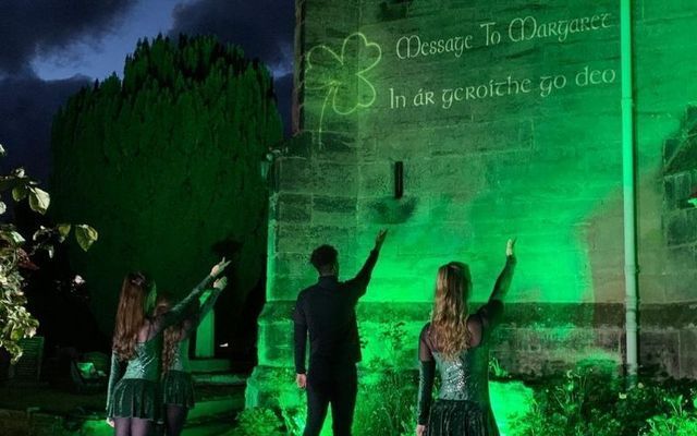 Margaret Keane\'s family lit up St. Giles Church in England with a well-known Irish phrase last summer during their campaign. 