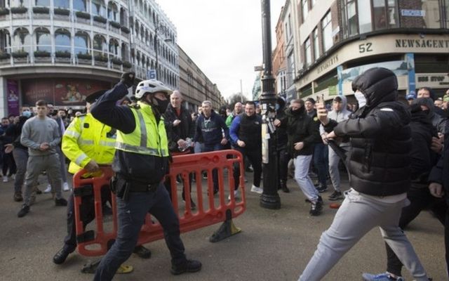 A protester clashes with a member of An Garda Síochána in Dublin City on Saturday. 