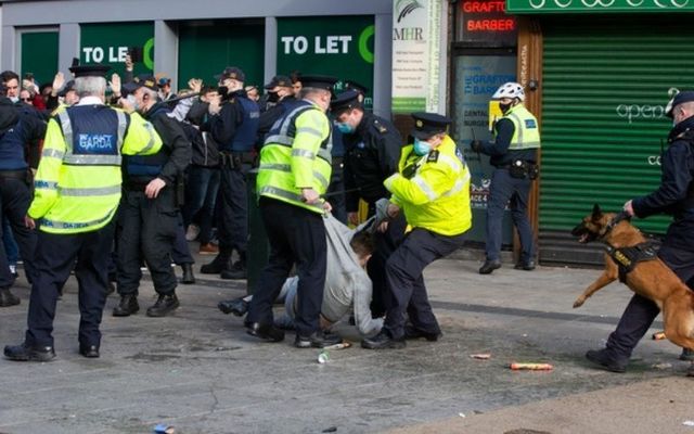 Gardaí apprehend a protester during Saturday\'s violent demonstration in Dublin City Center. 