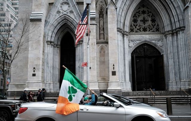 March 17, 2020: People celebrate St. Patrick\'s Day in front of St. Patrick\'s Cathedral even as the parade was canceled in New York City. 