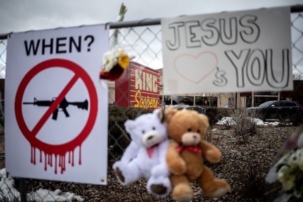 March 23, 2021: Memorials with signs, teddy bears, and flowers are left on the fencing surrounding the grocery store the day after a gunman opened fire at a King Sooper\'s grocery store on March 22, 2021 in Boulder, Colorado.