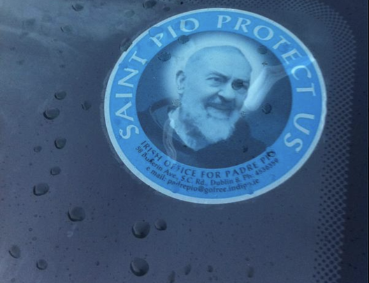 A Padre Pio car window sticker.