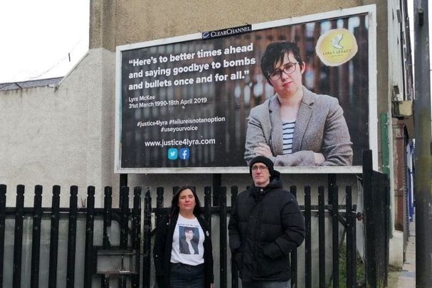Lyra McKee\'s relatives standing in front of a recently unveiled Justice 4 Lyra billboard in Derry.
