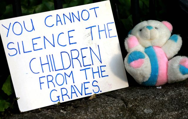 A placard outside Ireland\'s government buildings against the Mother and Baby Homes.