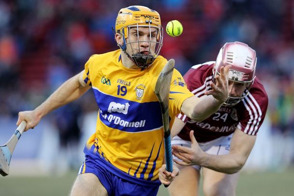 Nov 19, 2017: Shane O\'Donnell of Clare runs past Padraig Breheny of Galway during the 2017 AIG Fenway Hurling Classic and Irish Festival at Fenway Park in Boston, Massachusetts.