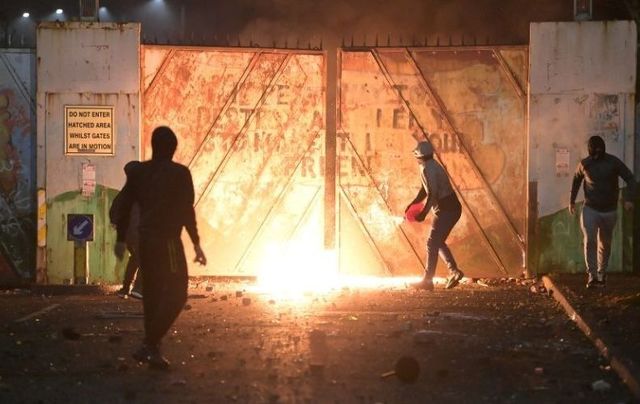 Loyalists burn a peace wall in Belfast during last week\'s riots. 