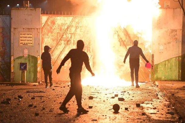 April 7, 2021: Fire fed by petrol burns as youths clashed at the Peace Gate at the Springfield Road/Lanark Way interface in Belfast, Northern Ireland.