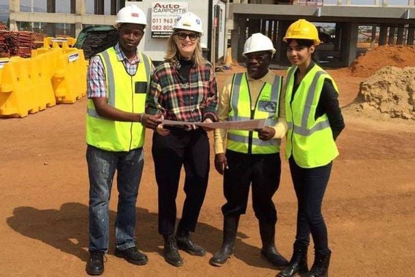 Deborah Terhune, second from left, at the building site for the Devland Soweto Education Campus in South Africa.