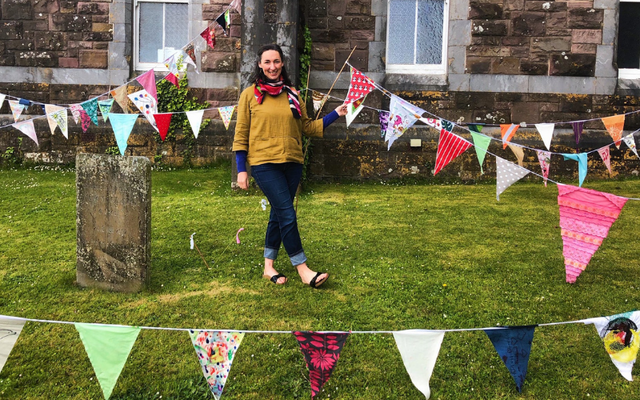 Visual artist Deirdre McKenna with the Féile na Bealtaine flag project, Ar Scáth a Chéile 