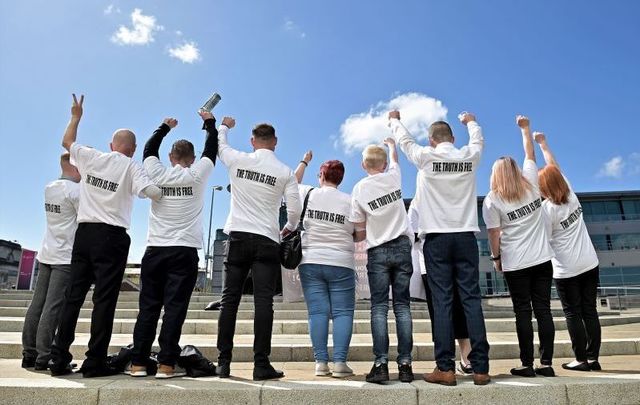 May 11, 2021: Relatives of victim Joseph Corr, wearing shirts that say \'The Truth is Free,\' react after the findings of the Ballymurphy Inquest were released by the coroner at the Waterfront Hall in Belfast, Northern Ireland.