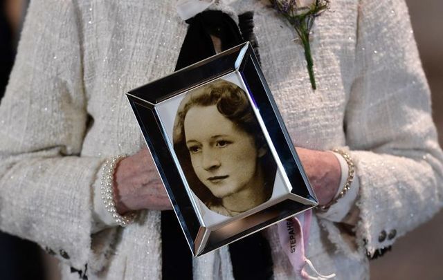May 11, 2021: A relative of Joan Connolly holds a photograph of Joan after the findings of the Ballymurphy Inquest were revealed at the Waterfront Hall in Belfast, declaring all ten victims innocent.