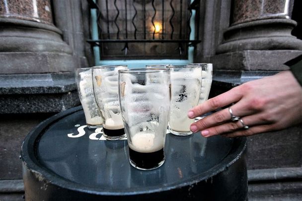 December 24, 2020: Empty pints of Guinness at the Stags Head in Dublin as pubs close at the 3 pm deadline in Dublin City Center.