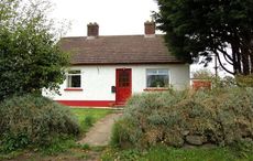 Own your very own red-doored cottage near an Irish lough for $220k