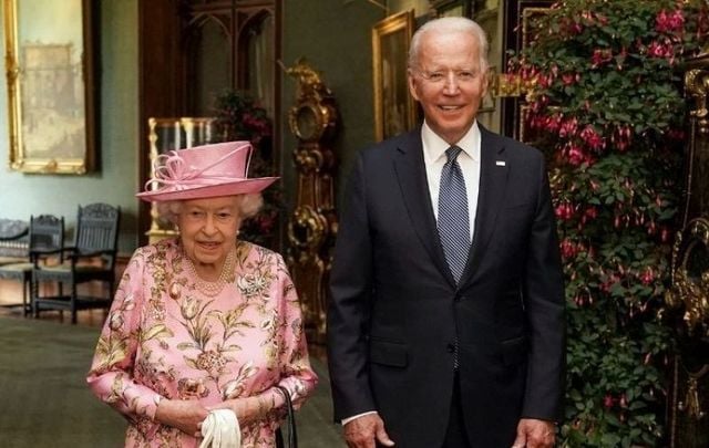 June 13, 2021: Queen Elizabeth II with US President Joe Biden in the Grand Corridor during their visit to Windsor Castle in Windsor, England.