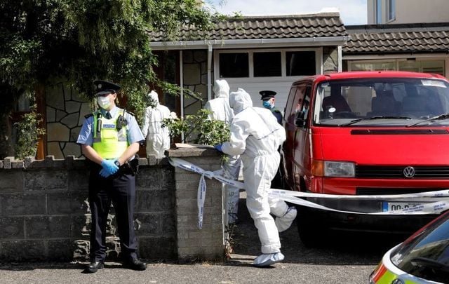 June 21, 2021: Garda wearing face masks as Technical Bureau (Forensic Teams) arrive outside a house in Carriglea View, a housing estate in Firhouse in Dublin where a man was fatally stabbed on June 20.