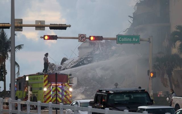 Search and rescue teams respond to the collapse of a 12-story tower in Surfside, Florida.\n