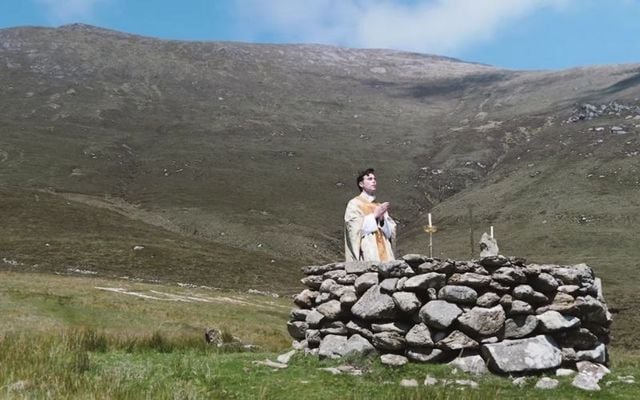 A priest celebrates mass at a Mass Rock