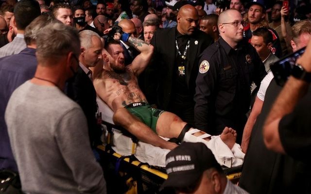 Conor McGregor departs Las Vegas\'s T-Mobile Arena on a stretcher following his defeat to Dustin Porier. 