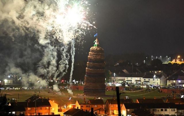 July 12, 2021: The 11th night bonfire which marks the beginning of the annual protestant 12th of July celebrations is lit in the Craigyhill housing estate in Larne, Northern Ireland. 
