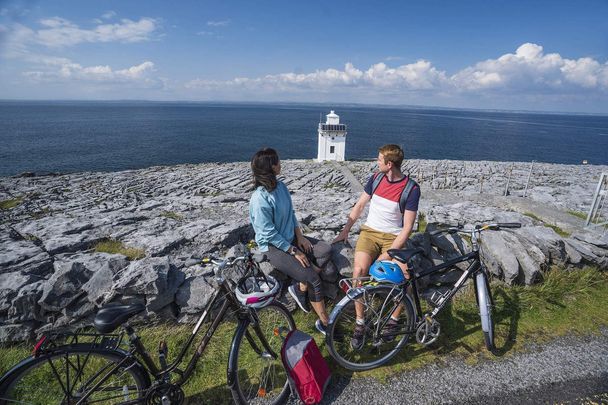 Black Head Lighthouse, The Burren, County Clare: Take a 70-kilometer bike ride around the karst landscape in the southwest of Ireland.
