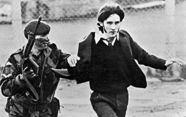 January 30, 1972: A British paratrooper takes a captured youth from the crowd on \"Bloody Sunday,\" when British paratroopers opened fire on a civil rights march, killing 14 civilians, in Derry. 