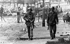 Irish government could not stand by Troubles amnesty, Coveney argues