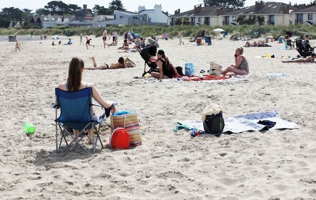 July 22, 2021: Burrow Beach in Sutton, Dublin, where members of the public gathered to enjoy the sun and go swimming amidst a heatwave.