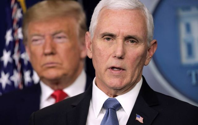 February 29, 2020: U.S. President Donald Trump listens as Vice President Mike Pence speaks during a news conference at the James Brady Press Briefing Room at the White House.