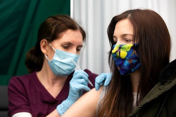 An Irish woman receives a Moderna vaccine. 