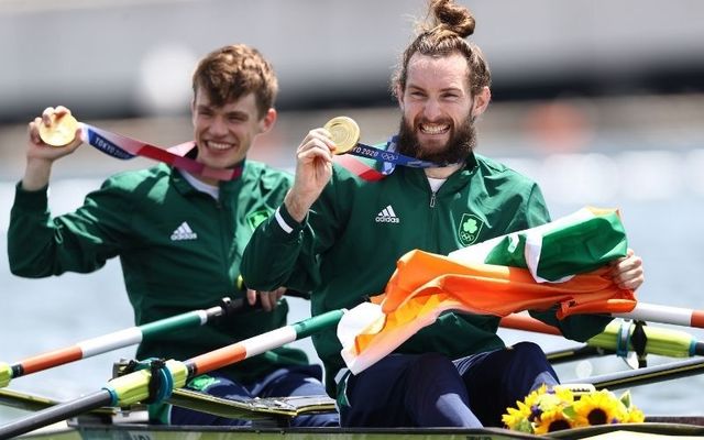 July 29, 2021: Gold medalists Fintan Mccarthy and Paul O\'Donovan of Team Ireland pose with their medals in their boat after the Lightweight Men\'s Double Sculls Final A on day six of the Tokyo 2020 Olympic Games at Sea Forest Waterway in Tokyo, Japan.